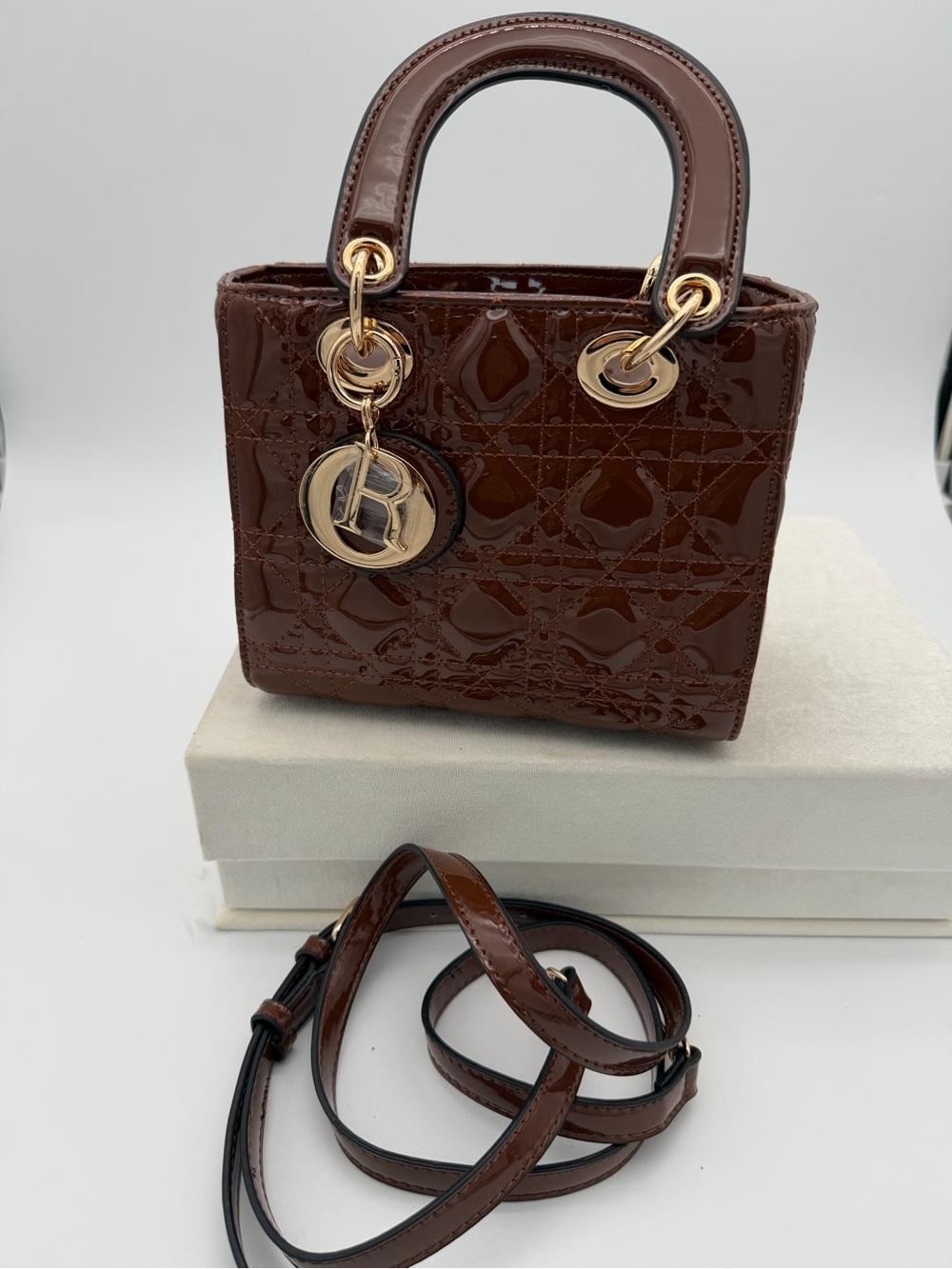 Beautiful, Brown Patent leather mini Bag with Gold Charm - Picture 9 of 15